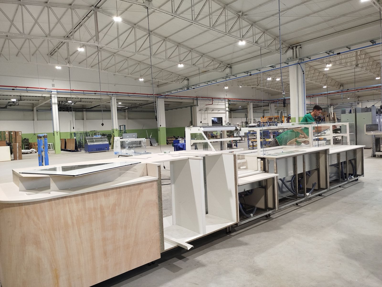 Custom serve-over counter line for a store project, in production on the fabrication floor